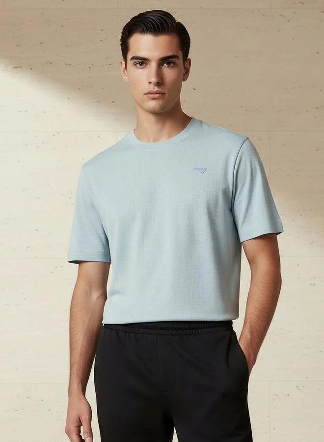 لي كوبر Lee Cooper Men Regular Fit Crew Neck Short Sleeves Badge Detail T-shirt